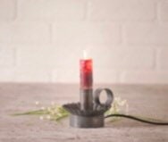 Moving flame bulb plug in tin ware