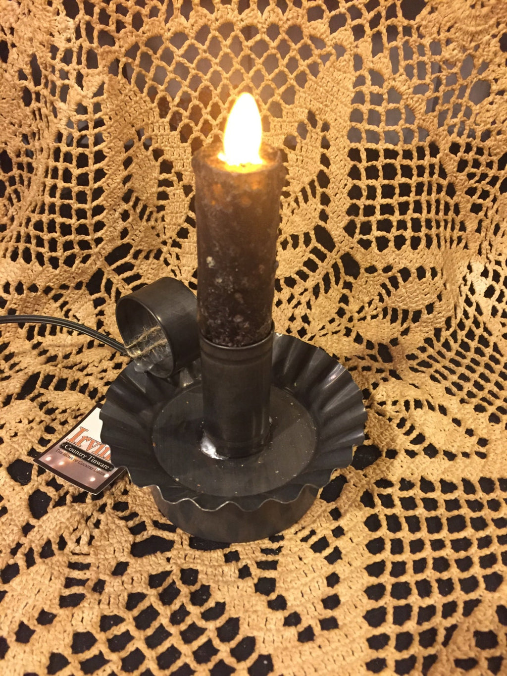 Moving flame bulb plug in tin ware